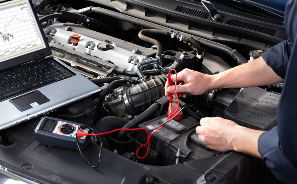 Close-up view of a GMC battery inspection by certified technician at Homan GMC of Ripon