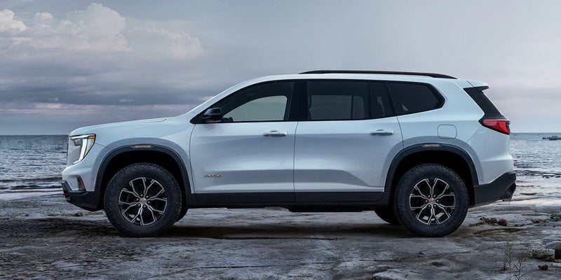 White 2026 GMC Acadia with side angle view